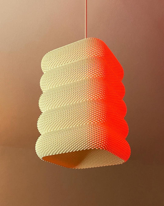 Textured pendant light with a gradient from red to green on a brown background