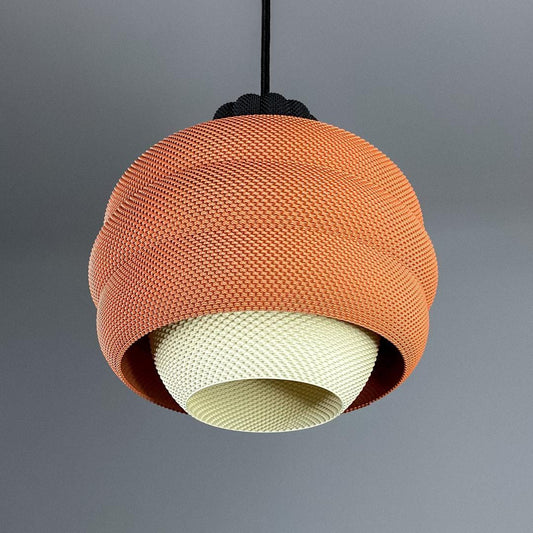 Pendant light with woven design on a gray background