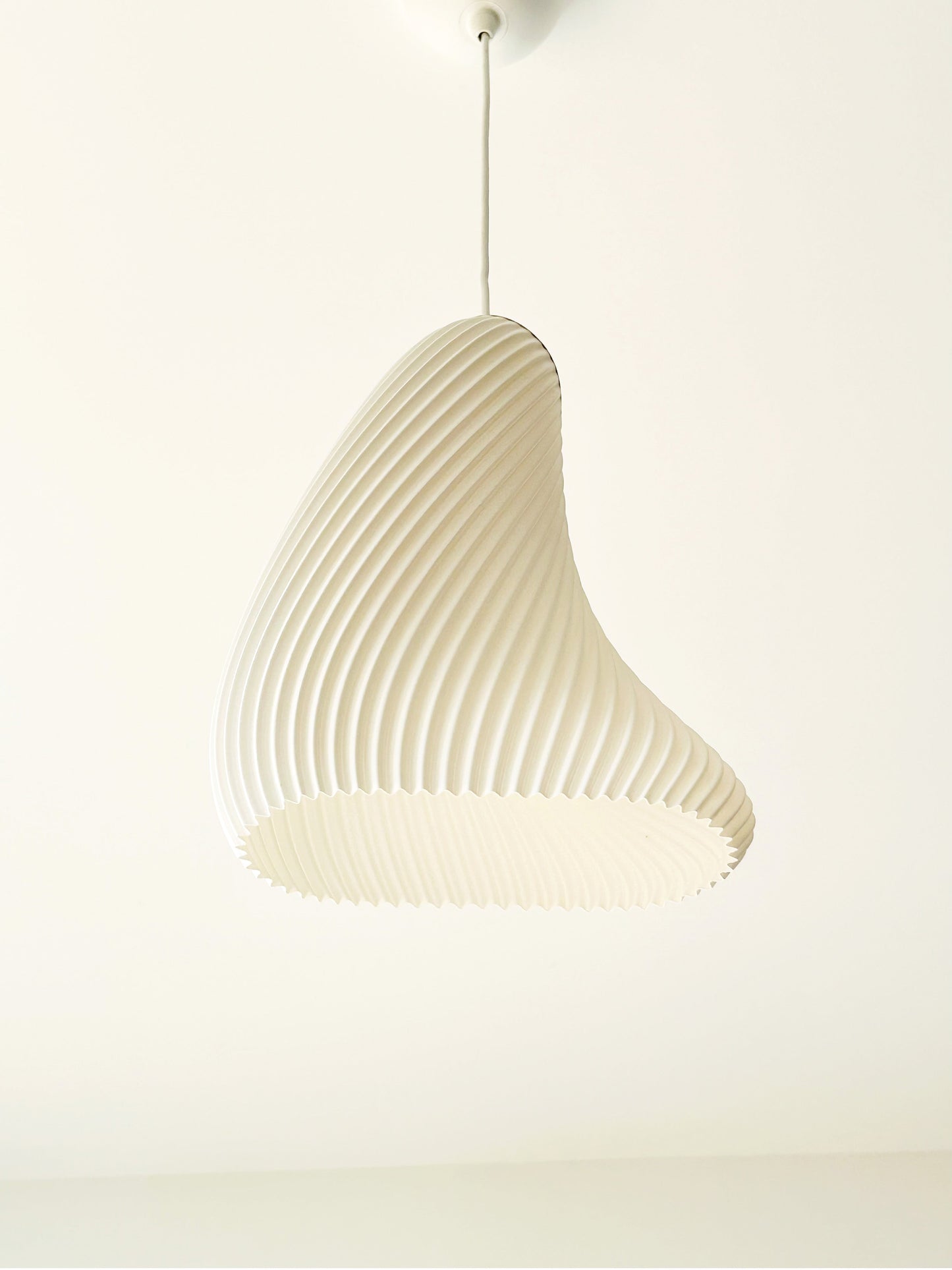 Beige pendant lamp on a white background