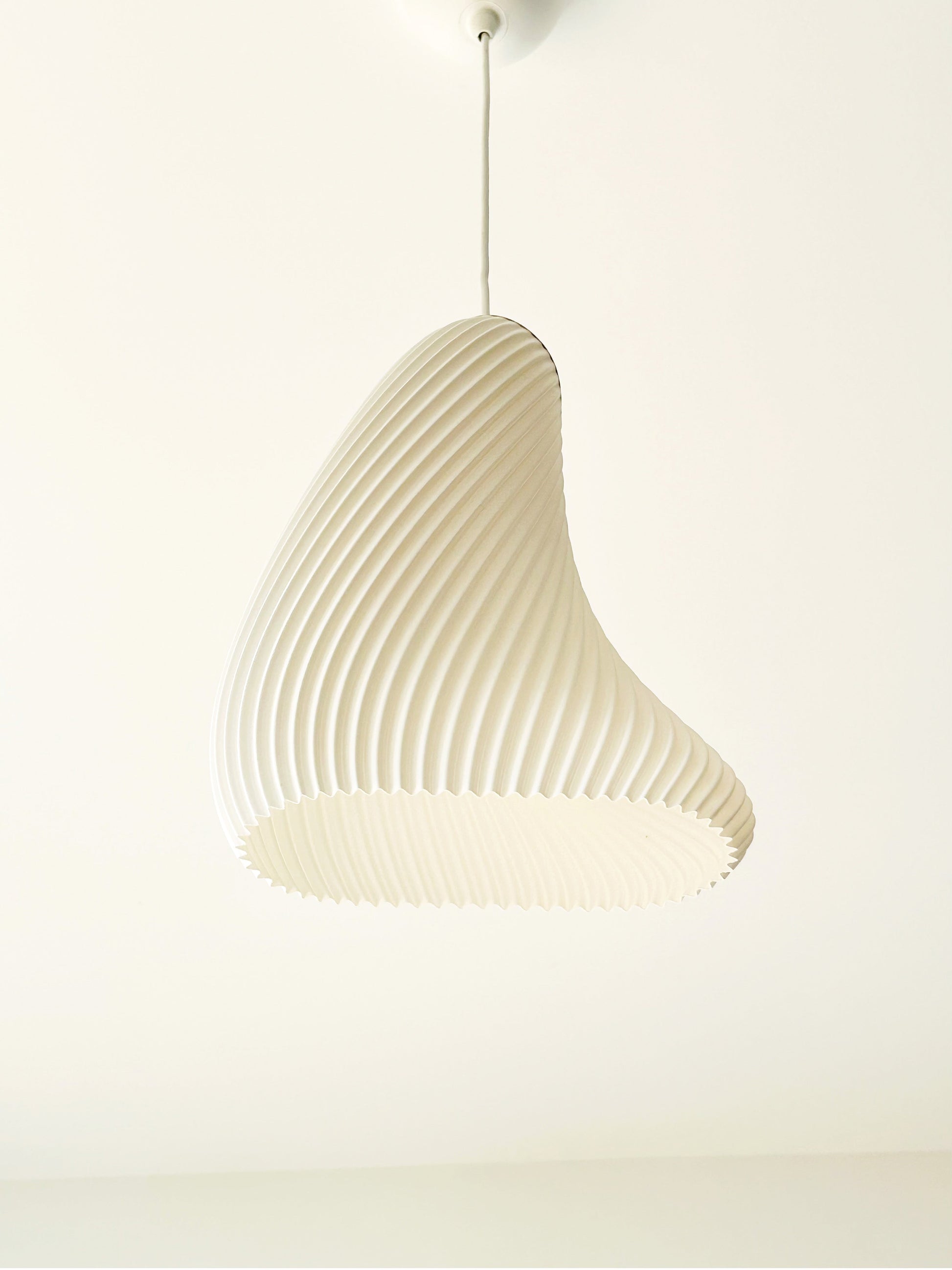 Beige pendant lamp on a white background
