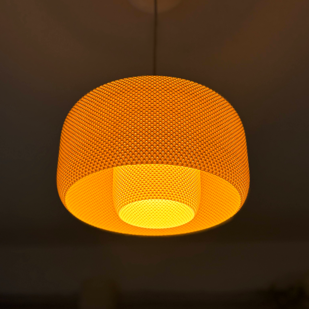 LOLA Orange woven pendant light against a dark background