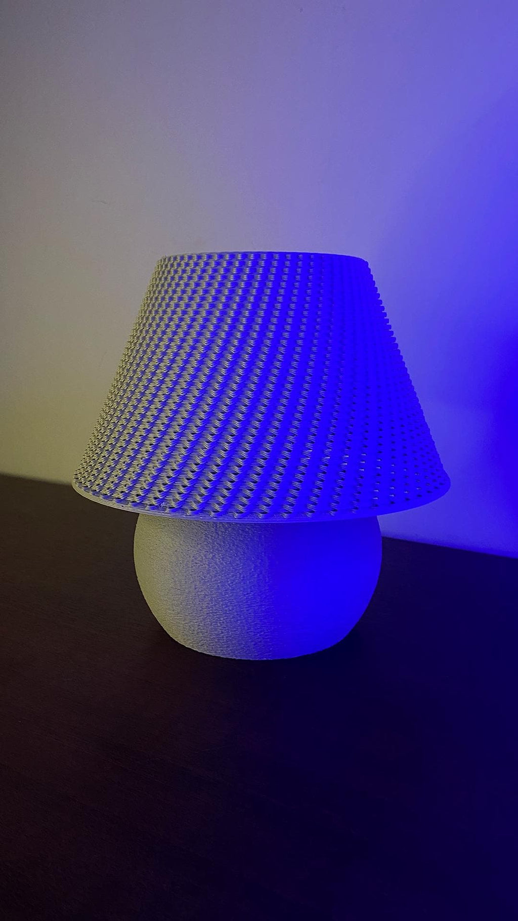 Lamp with blue LED light on a dark surface